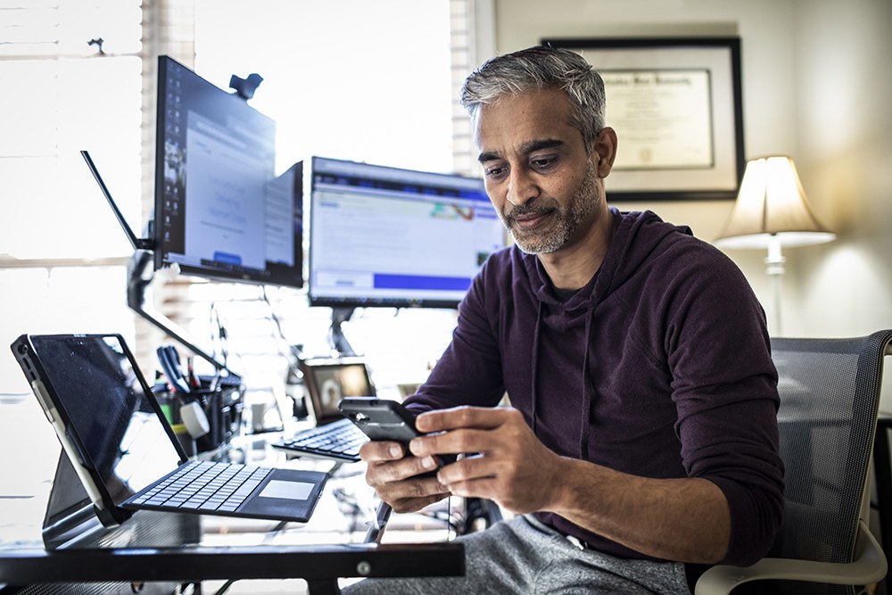 man using multiple devices at once