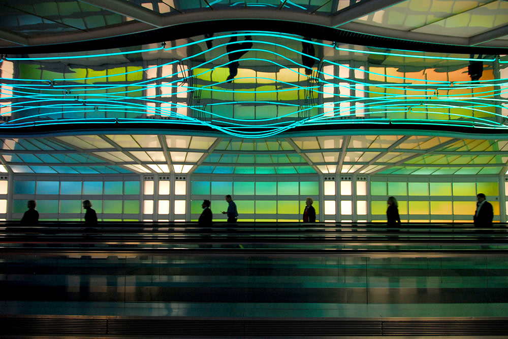 abstract view on neon lights in a building with people movers