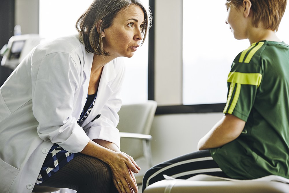 Doctor talking to child