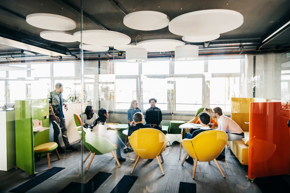 team working together in a colorful open office