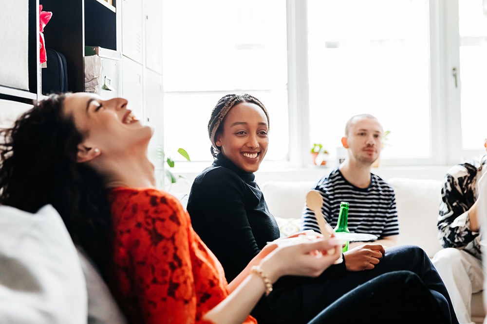Employee sitting laughing