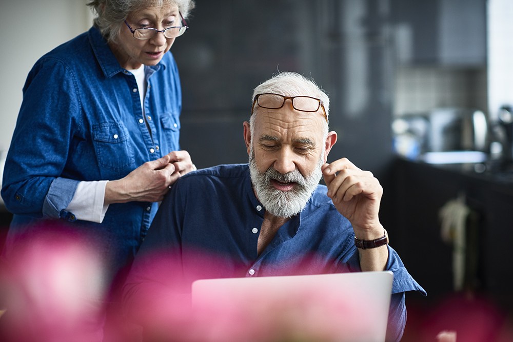 two people discussing laptop details